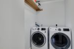 Laundry room with new washer and dryer